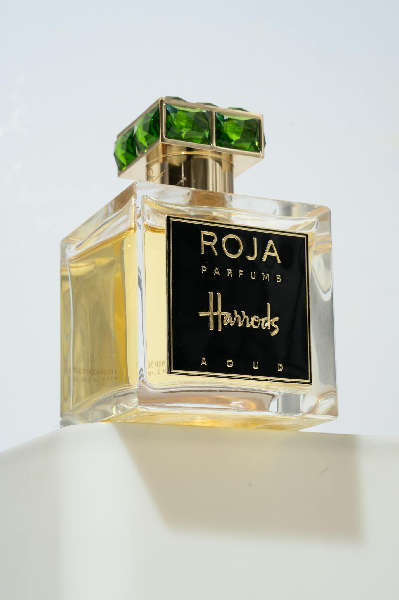 Artistic shot of a luxury perfume bottle with intricate details and elegant packaging.