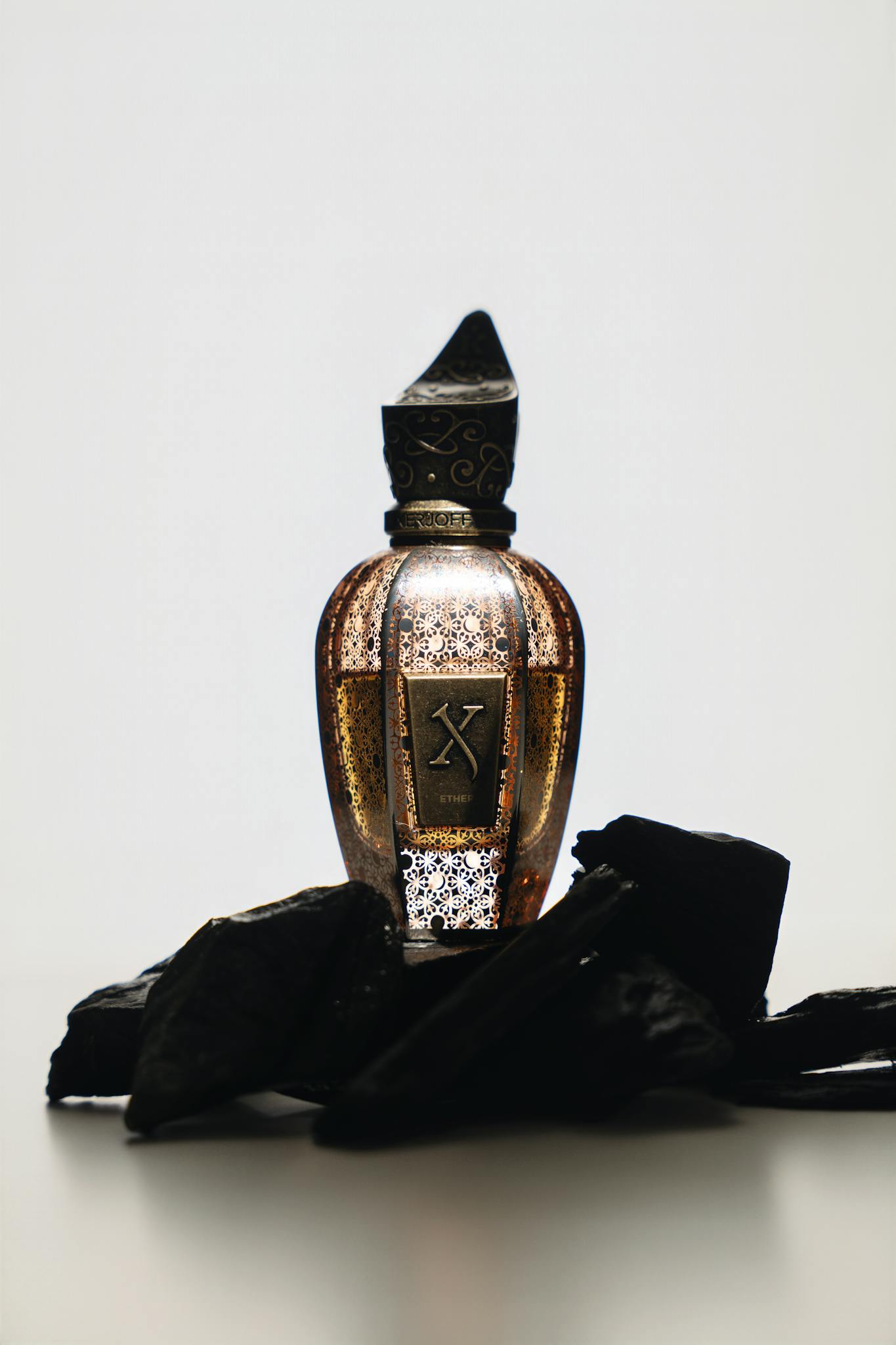 Elegant perfume bottle in artistic shot, showcasing luxury and sophistication in design.